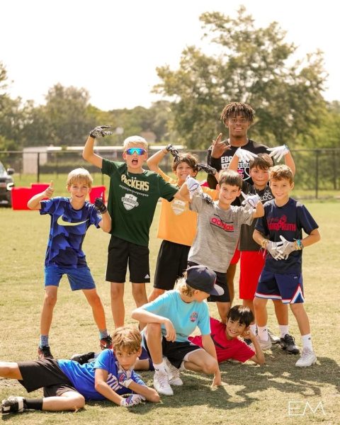 Image of children enjoying a youth camp, clickable link to Edgewater High School's Youth Football programs page.